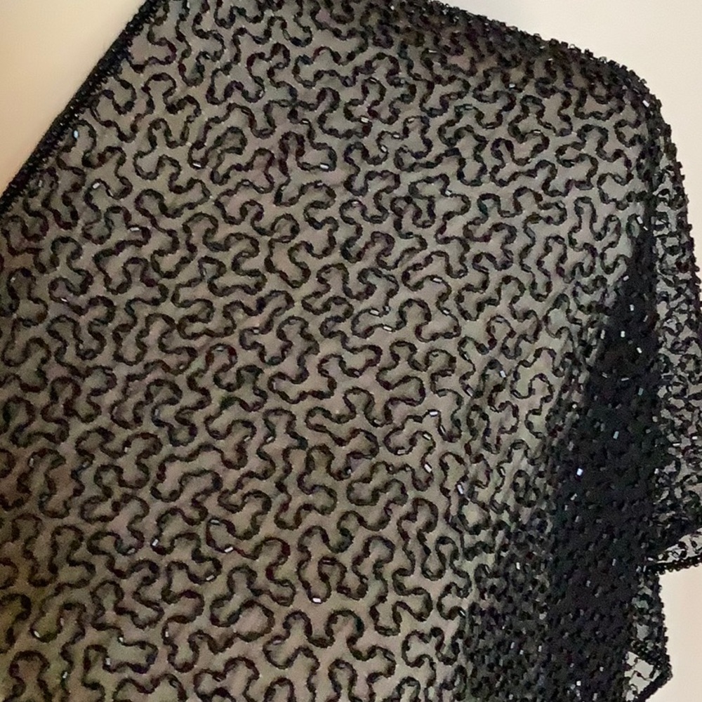 Gorgeous beaded 100% black silk scarf

Dimensions 13 inches by 58 inches
